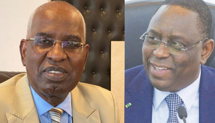 Le président Macky Sall (d) et son ministre de la Justice Malick Sall