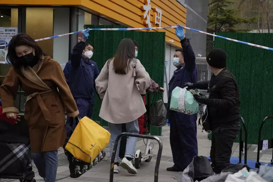 COVID-19 en Chine - Des millions de personnes confinées face à une flambée de cas record