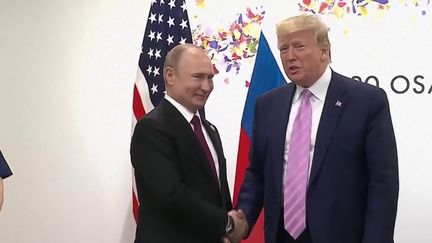 Donald Trump (d.) et Vladimir Poutine