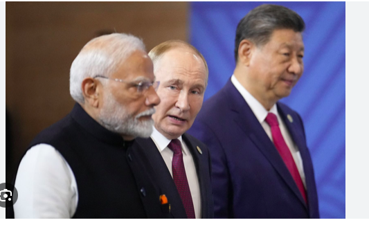 L'Indien Modi, le Russe Poutine et le Chinois Xi (de g. à d.), un front possible cotre Trump